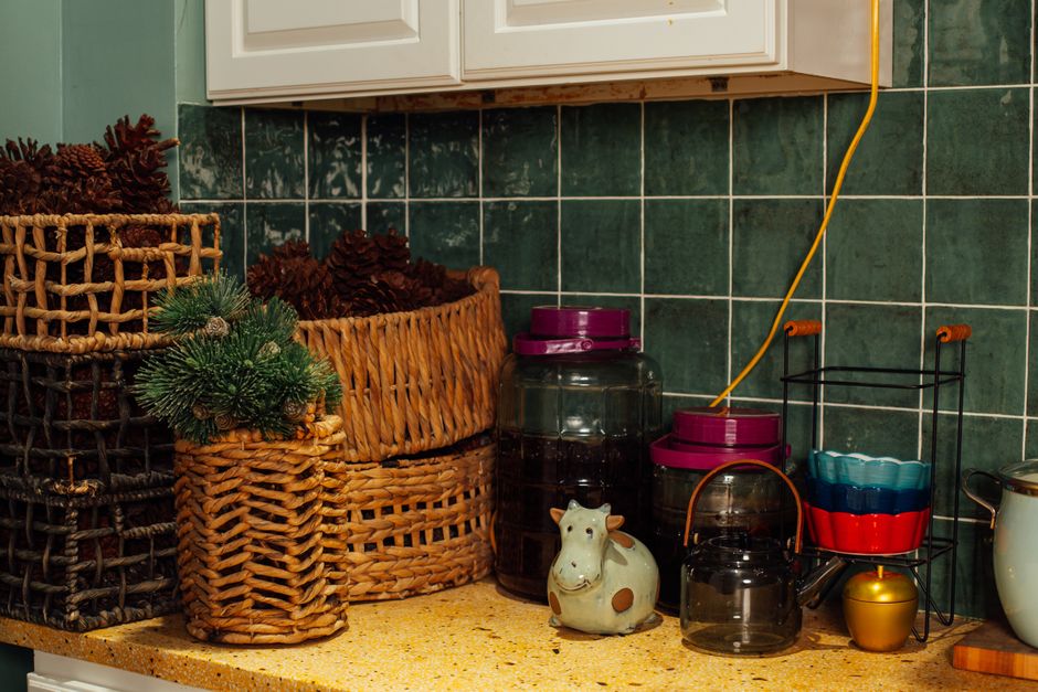 A charming kitchen corner featuring rustic baskets and kitchen accessories.